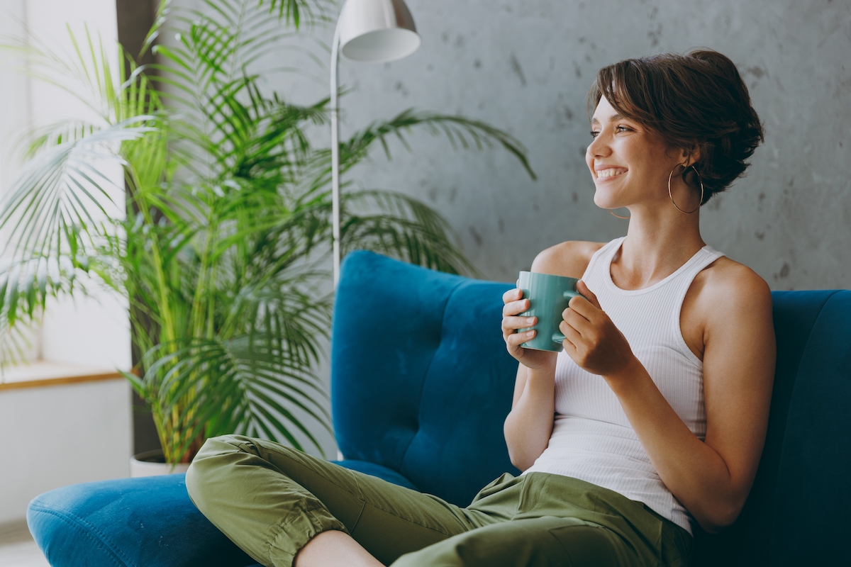 Side,View,Young,Woman,Wears,White,Tank,Shirt,Drink,Tea Astra APartments - Corporate Accommodation